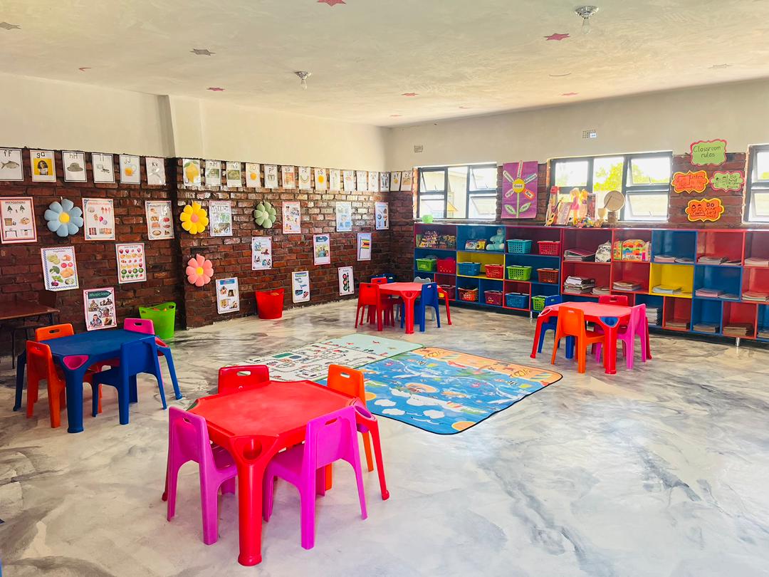 Classroom with phonics charts and reading corner